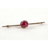 A ladies 15ct yellow gold bar brooch set, with a cabuchon Burmese ruby, approx 2ct