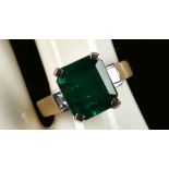 An 18ct gold, emerald and diamond set ring, emerald: 5.22ct, diamond: 0.43ct