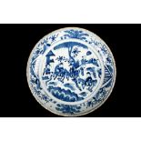 A PROVINCIAL BLUE AND WHITE BOYS DISH. Decorated with a central roundel depicting five boys