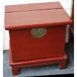 A pair of early 20th Century oriental tea cabinets cum desks, red painted finish with lift off