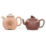 A CHEN ZIQI YIXING TEAPOT TOGETHER WITH ANOTHER TEAPOT. Early 20th Century. The first with four