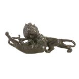 A BRONZE SCULPTURE OF A LION AND TIGER FIGHTING. The two animals locked in combat, the bronze