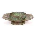 A CHINESE BRONZE HEXALOBED CUP STAND. Song Dynasty. The hollow-centred cup stand comprising of a