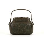 A CHINESE BRONZE HAND-WARMER AND COVER. Qing Dynasty. Of rectangular form, with rounded shoulders,