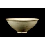 A YAOZHOU CELADON BOWL. Northern Song. With conical sides raised on a low foot rising to an