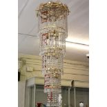 A 1980's brass framed chandelier, formed from five