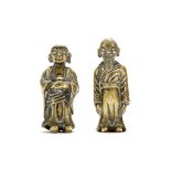 A PAIR OF FIGURATIVE SCROLL WEIGHTS. Late Ming, 17th Century. Both standing,, one with arms apart,