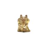 A CHINESE GILT BRONZE BEAR-FORM SUPPORT. Han Dynasty. Cast in the shape of a seated bear with a