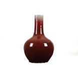 A CHINESE OX BLOOD VASE. Late Qing. Of pear-shaped form, the streaky deep red crackle glaze,
