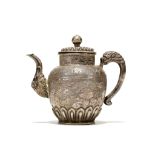 A TIBETAN SILVER TEAPOT AND COVER. 18th / 19th Century. Of similar form to lot 265, but of more