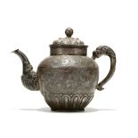 A TIBETAN SILVER TEAPOT AND COVER. 18th / 19th Century.  Of well-proportioned form with a globular