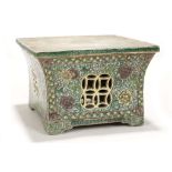 A FAMILLE VERTE SQUARE SECTION STAND. Qing Dynasty, Kangxi. Of square form with inward-curving