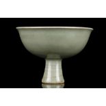 Ming Dynasty, 15th Century. The wide flared bowl raised on a splayed columnar foot incised with a