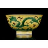 A CHINESE GREEN AND AUBERGINE-GLAZED YELLOW GROUND DRAGON DISH. Kangxi mark and of the period. The