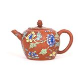 A CHINESE ENAMELLED YIXING TEAPOT AND COVER. Qing Dynasty, 18th Century. The globular body decorated