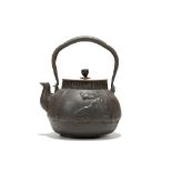 A JAPANESE IRON TETSUBIN KETTLE AND COVER. Edo. 18th / 19th Century. The fat body with sloping