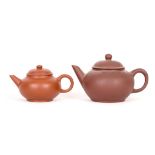 TWO MINATURE YIXING TEAPOTS AND COVERS. Late 20th Century. 5.5cm H / 6.5cm H. (2). Provenance: one