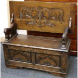 Monks bench, oak, c.1920/30, carved rest, lion supports, box seat, 107cm