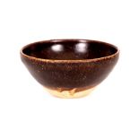 A CHINESE JIZHOU TEABOWL. Song. The interior and exterior with a blackish-brown glaze ending on