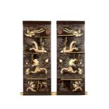 A PAIR OF BLACK LACQUERED RECTANGULAR DRAGON AND PHOENIX WALL STANDS. Late Qing. Carved with