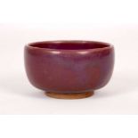 A JUN STYLE TEABOWL. Early 20th Century. The tall sided cup covered with an attractive purple