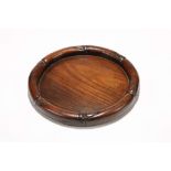 A CHINESE CIRCULAR HONGMU TRAY. Late Qing, 19th Century. The raised semi-cylindrical rim as a