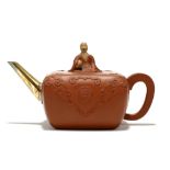 A CLOBBERED YIXING TEAPOT AND COVER. Qing Dynasty, 19th Century. Of rounded rectangular form, the