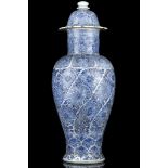 A CHINESE BLUE AND WHITE VASE AND COVER. Kangxi. Of tall, slender ovoid shape, with convex spreading