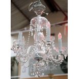 A pair of crystal glass, five branch chandeliers with garlands of buttons and strings of drops, 80cm