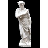 A large composite life size statue of a Roman maiden holding a scroll, by Repute, from the set of