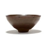 A CHINESE JIANYAO CHOCOLATE BROWN GLAZED TEABOWL. Song. With rounded sides raised on a straight