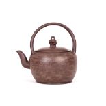 A CHINESE YIXING KETTLE AND COVER. 20th Century. With double looped handle, and knot-form finial,