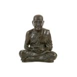 A JAPANESE TOKYO SCHOOL BRONZE OF A SEATED FIGURE. Meiji Period. Finely cast with legs crossed,