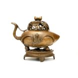 A CHINESE BRONZE PEACH FORM CENSER AND COVER WITH OPENWORK STAND. Late  19th / early 20th Century.