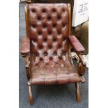 A 20th Century, leather button back armchair, maho