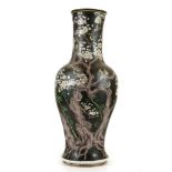 A LARGE CHINESE FAMILLE NOIRE VASE. Late Qing, 19th Century. Painted with a gnarled flowering plum