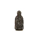 A CHINESE SNUFF BOTTLE WITH SILVER INLAY. Qing Dynasty, Shunzhi, 1652. The copper bottle with