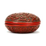 A CHINESE CINNABAR LACQUER CIRCULAR BOX AND COVER. Late Qing, 19th Century. Decorated with a phoenix