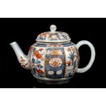 A CHINESE IMARI TEAPOT AND COVER. Qing Dynasty, 18th Century. Of lobed globular form, decorated with