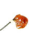 A RAT AND LINGZHI AMBER PENDANT. Late Qing. The body curled over a lingzhi spray which the rat is