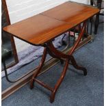 A Georgian mahogany coaching table, folding top on scroll legs, 89cm wide