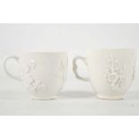 TWO BOW COFFEE CUPS, circa 1750-55, both in Chinese 'blanc-de-chine' style, applied with relief