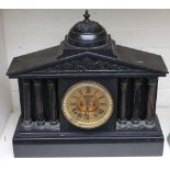 A large Victorian black marble mantel clock