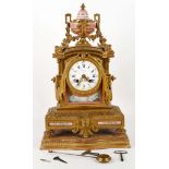 A 19th century French gilt bronze and Paris porcelain clock, having a Jappy Freres movement, white