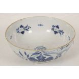 AN ENGLISH DELFT PUNCH BOWL, circa 1760, the exterior decorated with stylised flowers and foliage in