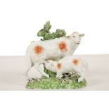 A DERBY GROUP OF SHEEP, circa 1765, modelled as a lamb sucking a sheep before floral bocage, their