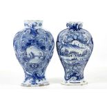 TWO DUTCH DELFT VASES, late 18th or early 19th century, both of octagonal baluster shape,