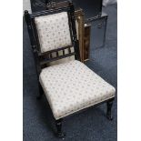 A Victorian button back nursing chair, a green upholstered tub chair and a Victorian ebonised