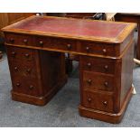 An Edwardian burr walnut twin-pedestal desk, the c