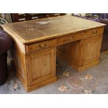 A fine partner's desk with leather writing surface, drawers to both sides in the frieze and drawer